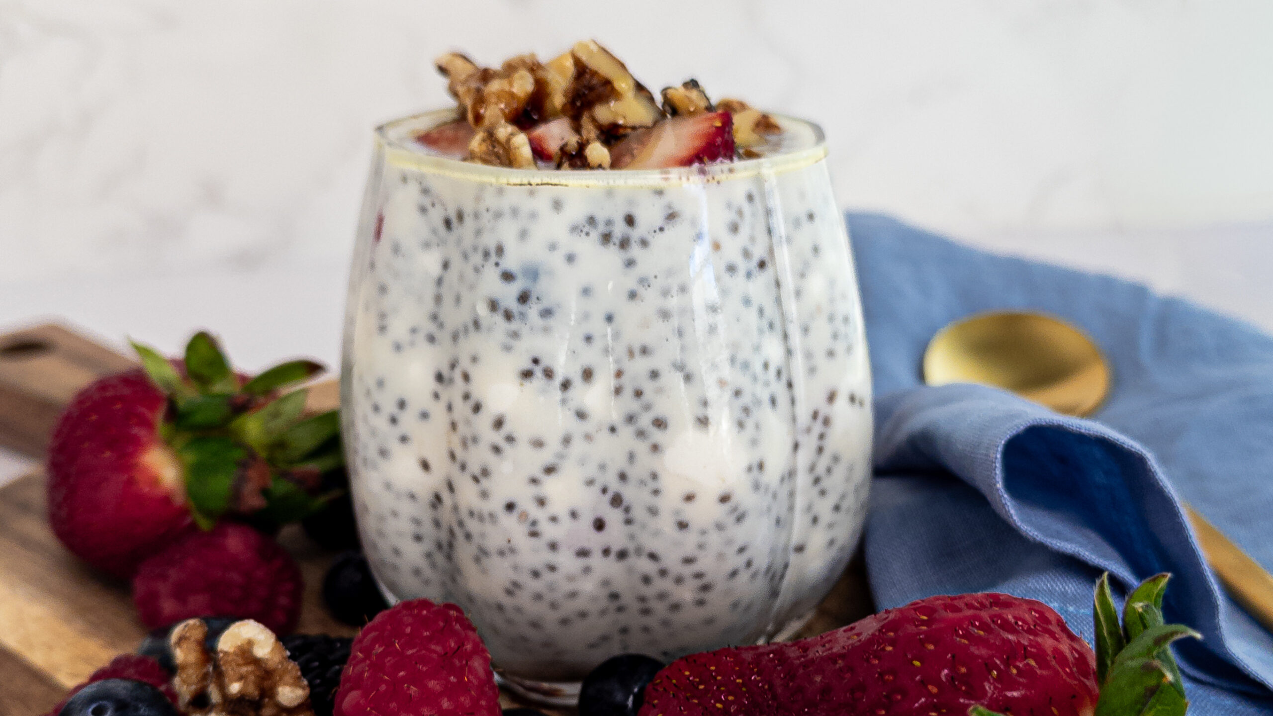 Cheesecake-like Chia Pudding with strawberries and walnuts