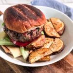 Zesty mediterranean burger with steak fries hero