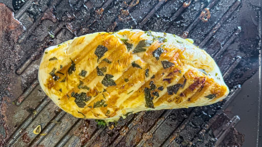 juicy lemon herb chicken process shot on grill