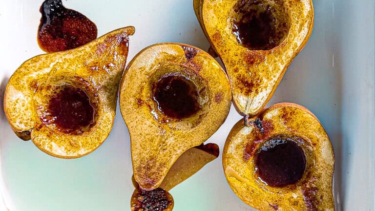 Fresh Bosc pears drizzled with maple and olive oil, ready to serve.