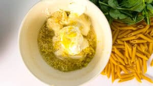 lemon ricotta protein pasta, ricotta, olive oil, lemon zest, lemon juice, seasonings in a bowl.