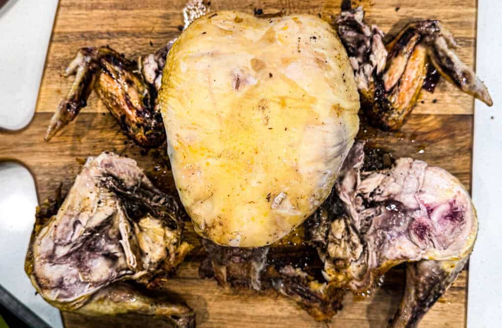whole chicken with legs, thighs, and wings cut.