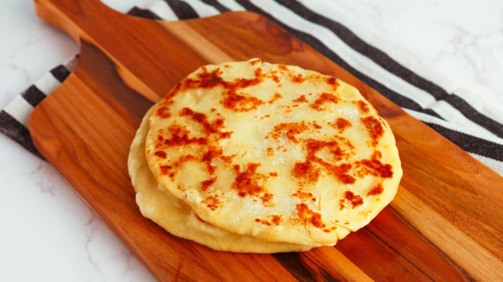 Delicious homemade flatbread with golden-brown crust, perfect for sharing or pairing with dips and t.