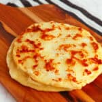Delicious homemade flatbread with golden-brown crust, perfect for sharing or pairing with dips and t.