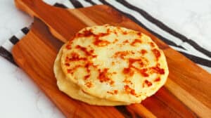 Delicious homemade flatbread with golden-brown crust, perfect for sharing or pairing with dips and t.