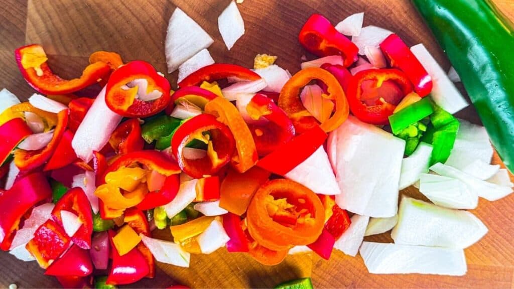 Fresh chopped bell peppers and onions for healthy cooking at The Lemon Hearth.