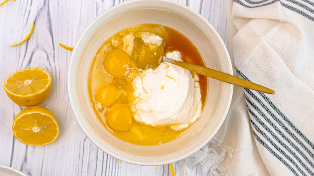 Eggs, yogurt, vanilla, and olive oil ready to be mixed