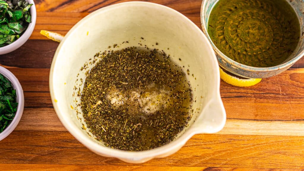 oregano, Dijon, lemon juice, zest, salt and pepper in a bowl