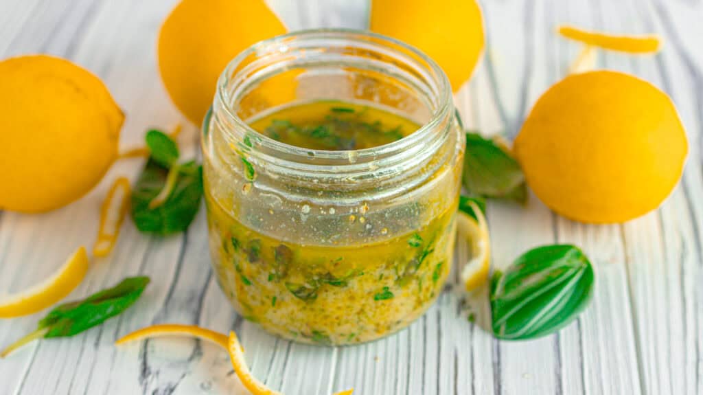 lemon-orange dressing surrounded by lemons