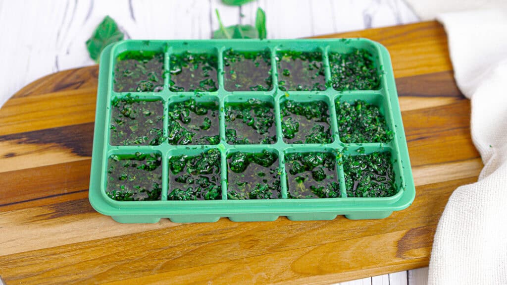 fresh basil and olive oil in silicone ice cube tray